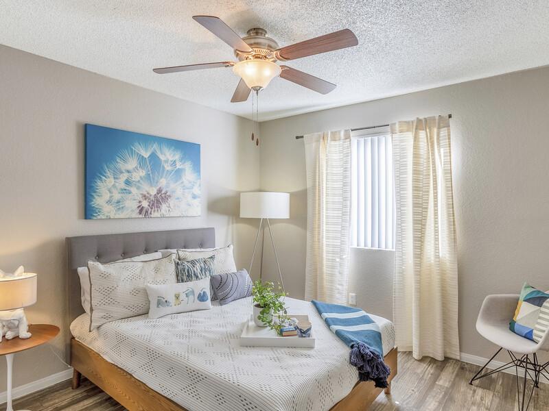 Bedroom with a Ceiling Fan | Emerson Square Apartments in Tempe, AZ