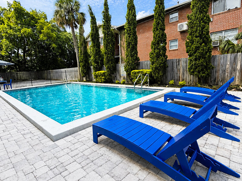 Outdoor Pool with Lounge Seating and View of Apartment Property | The Edge @ 401