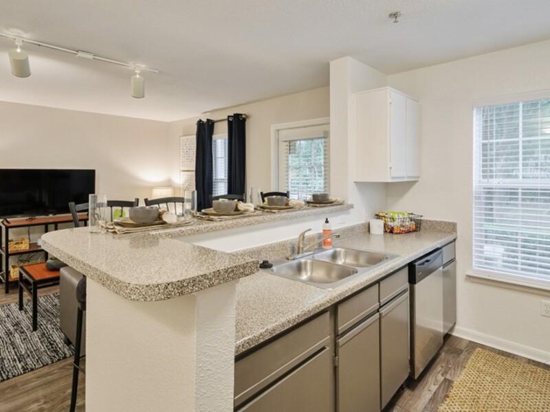 Kitchen and Living Room | ACASĂ Bainbridge Apartments in Tallahassee, FL