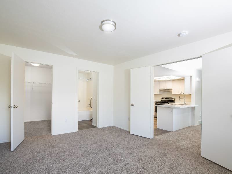 Bedroom with Large Closet and Bathroom | Creekside Village Apartment Homes in Sandy, UT