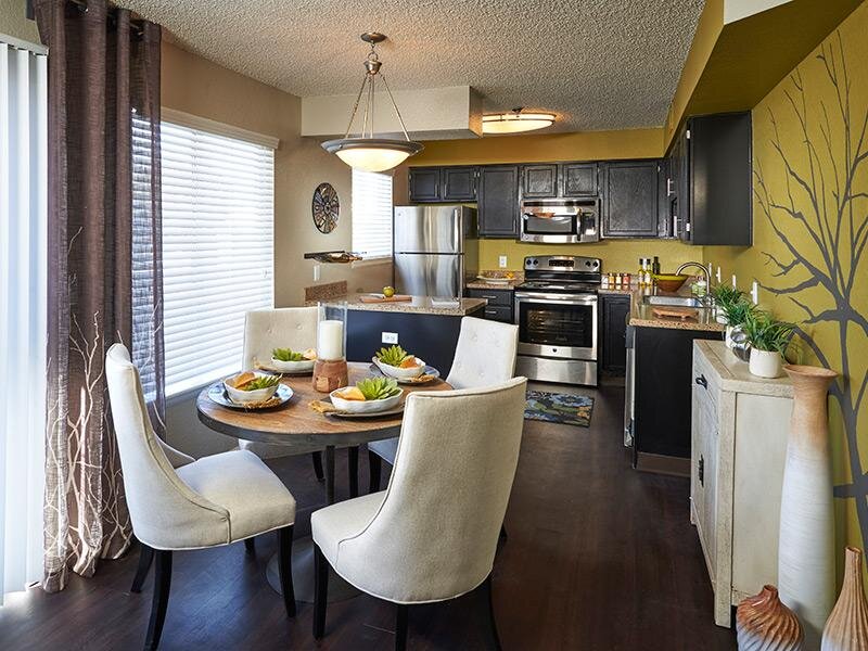 Model Dining Area and Kitchen | Arapahoe Club Apartments in Denver, UT