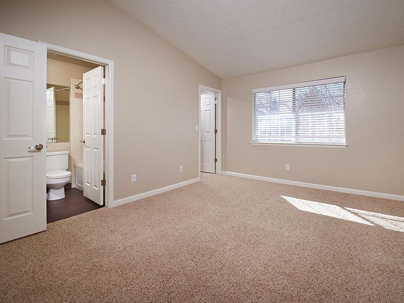 Bedroom and Bathroom | Arapahoe Club Apartments in Denver, UT