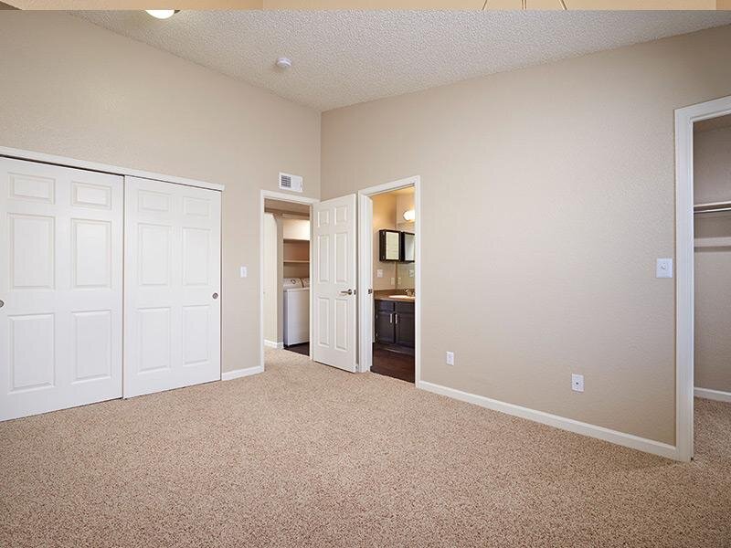 Carpeted Bedroom | Arapahoe Club Apartments in Denver, UT
