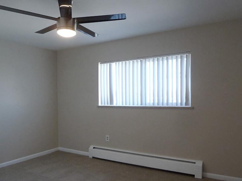 Bedroom with a Ceiling Fan | Tailwind 1 Apartments in Aurora, CO