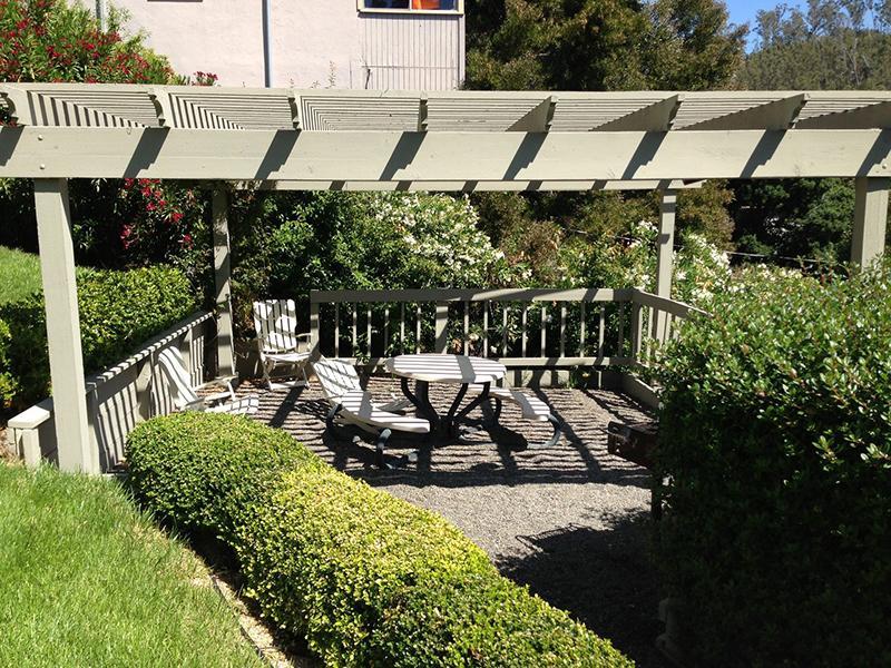 San Rafael Apartments - Park Hill Studios - Shaded Picnic Area with Table and Surrounded by Trees.