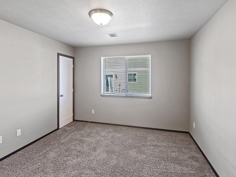 Bedroom with Dark Baseboards | 41st Street Commons in Sioux Falls, SD