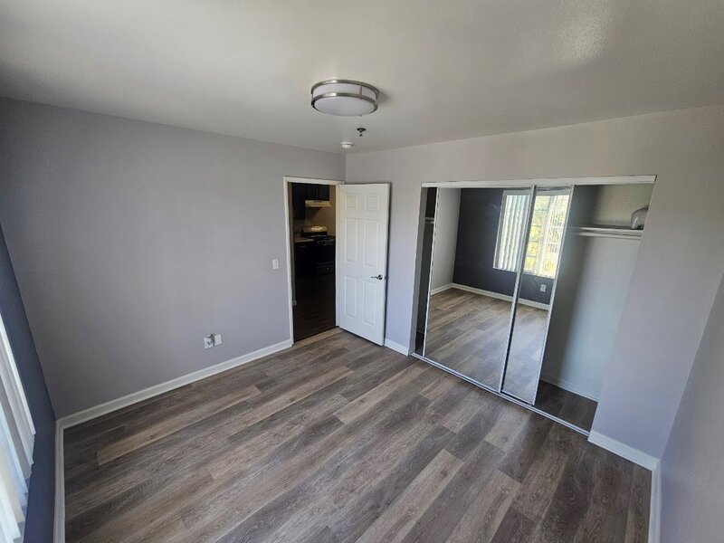 Bedroom with Mirrored Closet