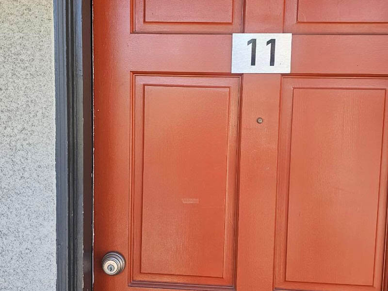 Red Wood Style Apartment Door | The Grand at 5746