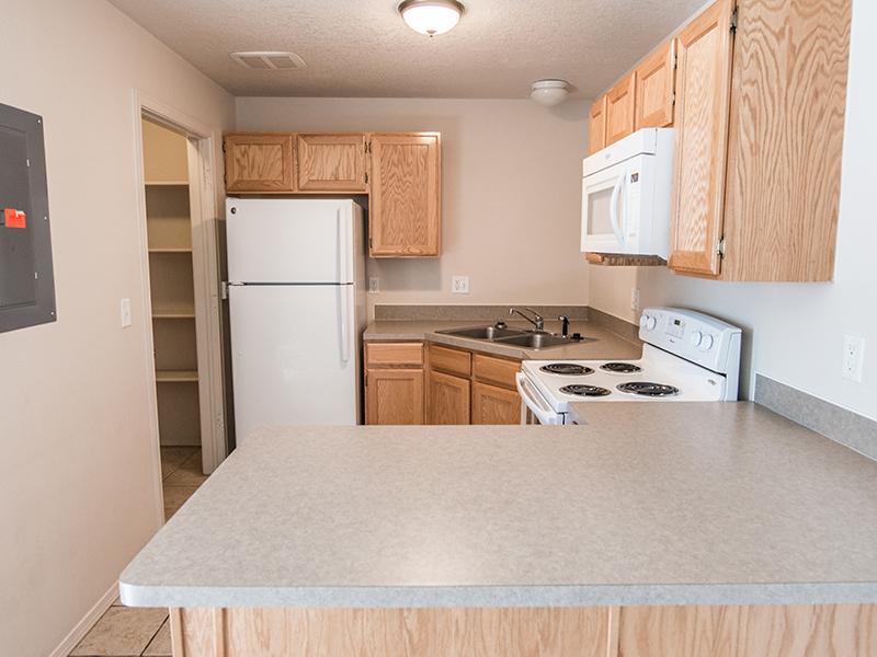 Kitchen | Pepperwood Village Apartments in Ammon, ID