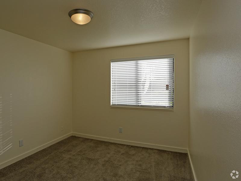 Carpeted Bedroom | Goldstone Place Apartments in Clearfield, UT