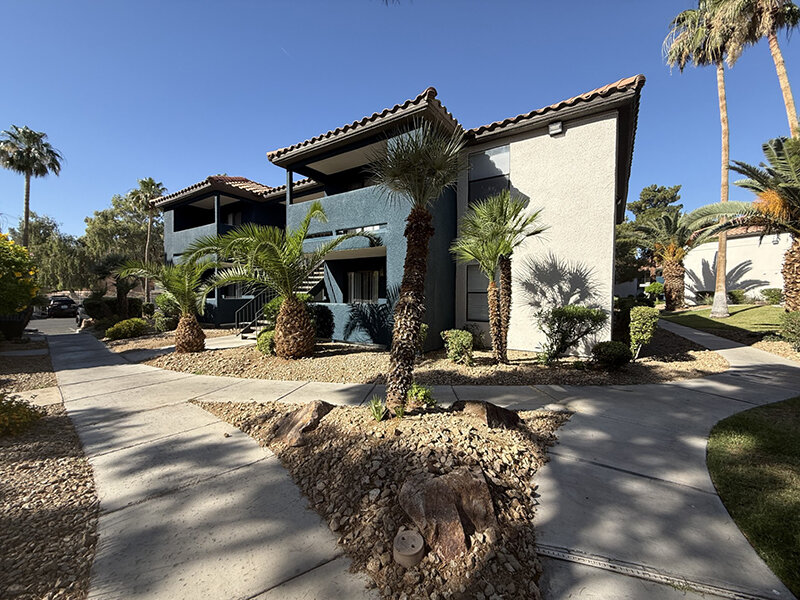 Exterior View of Apartment Property with Sidewalks | Sevilla Apartments and Condominiums