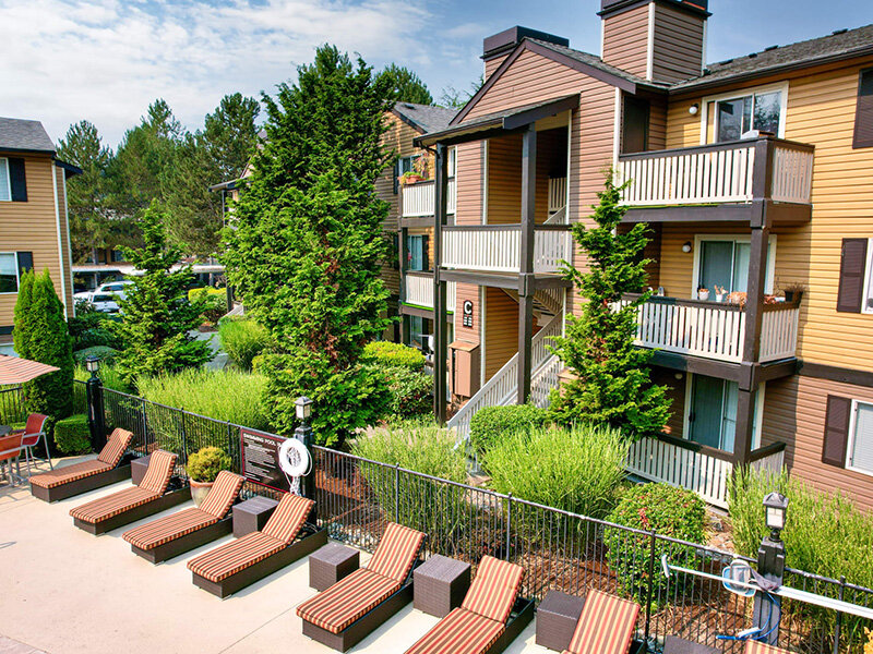 Seating Around Pool | Newport Crossing Apartments in Newcastle, WA
