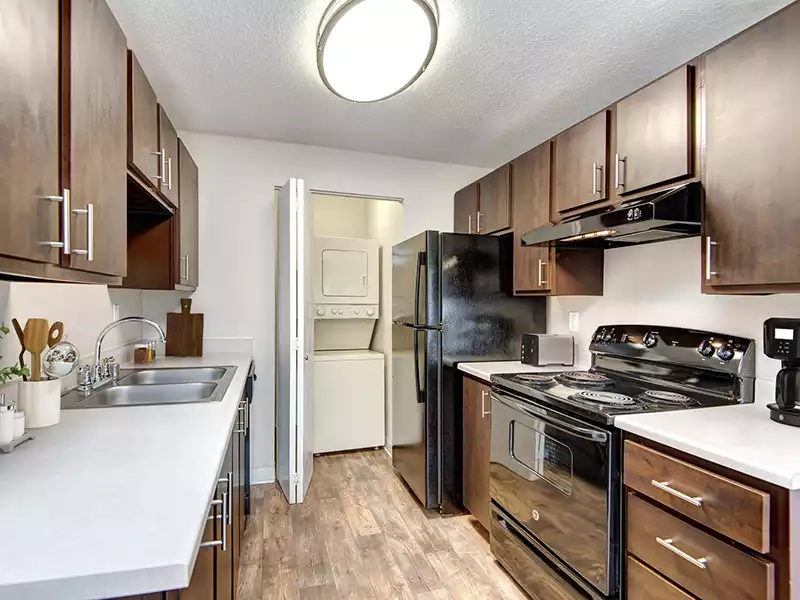 Kitchen and Laundry | Wellington Apartments in Silverdale, WA