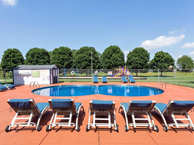 Seating by Pool | Kimber Green Apartments in Evansville, IN