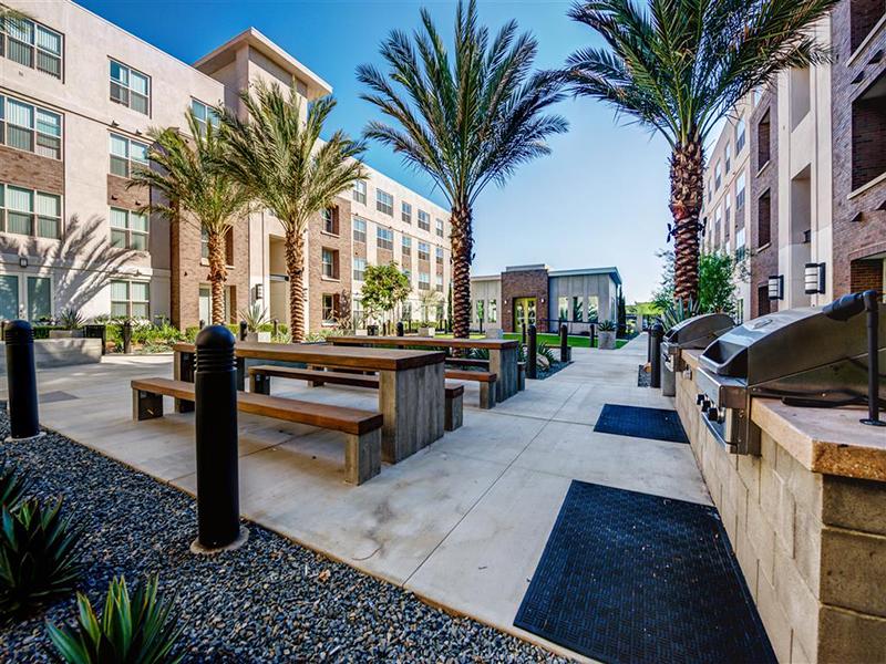 Grill Area with Seating | Monterey Station Apartments in Pomona, CA