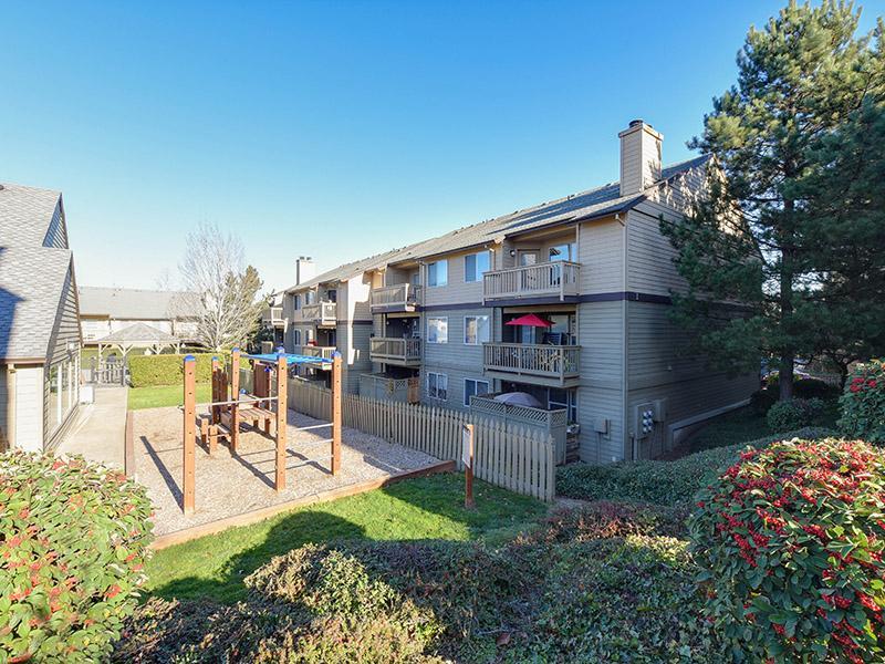 Apartment Exterior With Playground | Powell Valley Farms Apartments in Gresham OR
