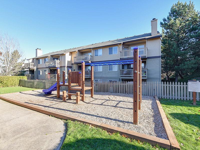 Tot Lot With Exterior Playground | Powell Valley Farms Apartments in Gresham OR