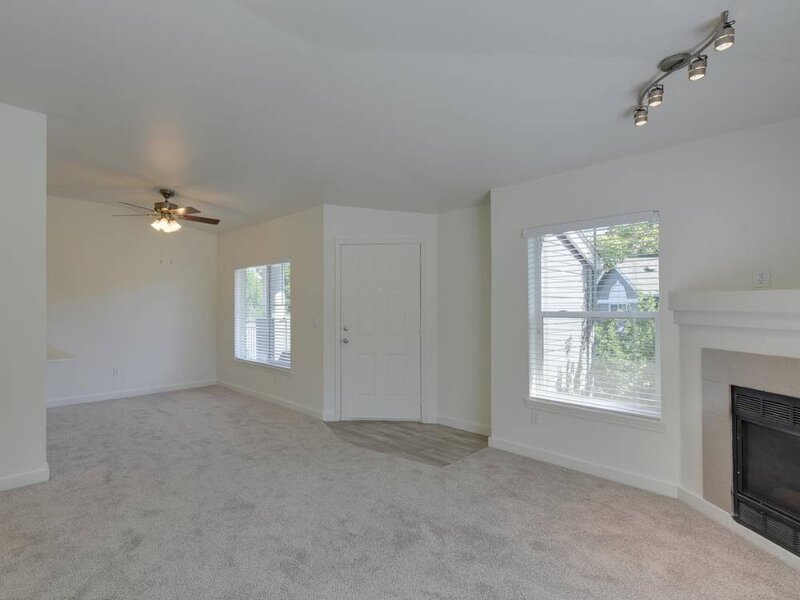 Living Room with Large Windows and Ceiling Fans | Sunfield Lakes Thumbnail