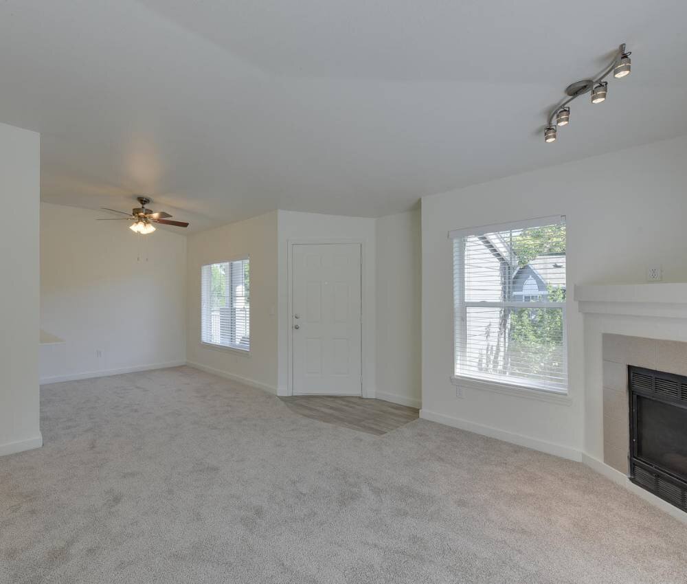 Living Room with Large Windows and Ceiling Fans | Sunfield Lakes