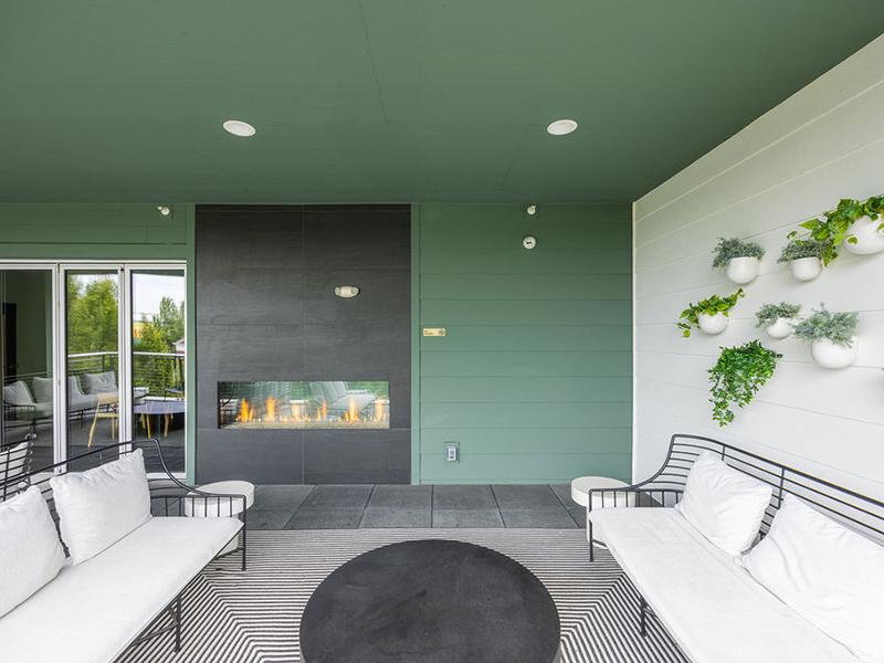 Outdoor Fireplace | East of Eleven Apartments