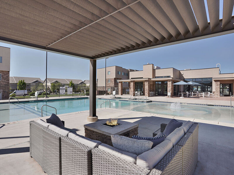 Outdoor Firepit and Swimming Pool | Coyote Creek Apartments