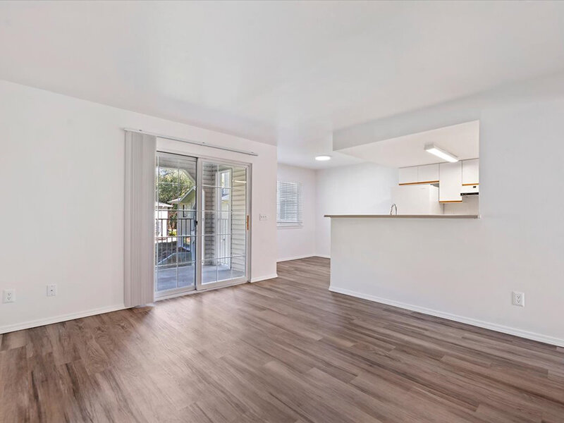 Living Room with Wood Like Flooring | Spring Creek Apartments