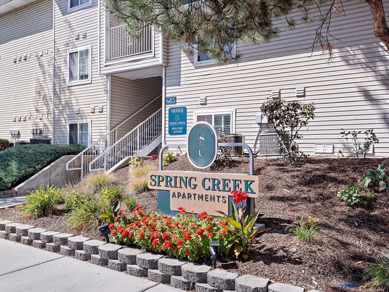 Apartment Exterior with Signage | Spring Creek Apartments