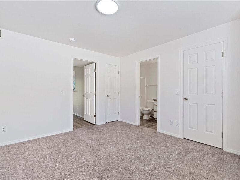 Carpeted Bedroom | Spring Creek Apartments