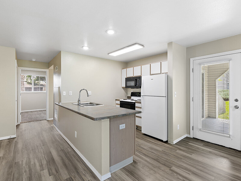 Kitchen with Counter and Kitchen Sink with Wood Style Flooring | Spring Creek