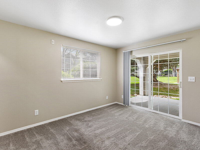 Living Room with Open Window and Carpeted Flooring | Spring Creek