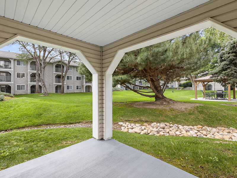 Apartment Exterior View with Foliage | Spring Creek