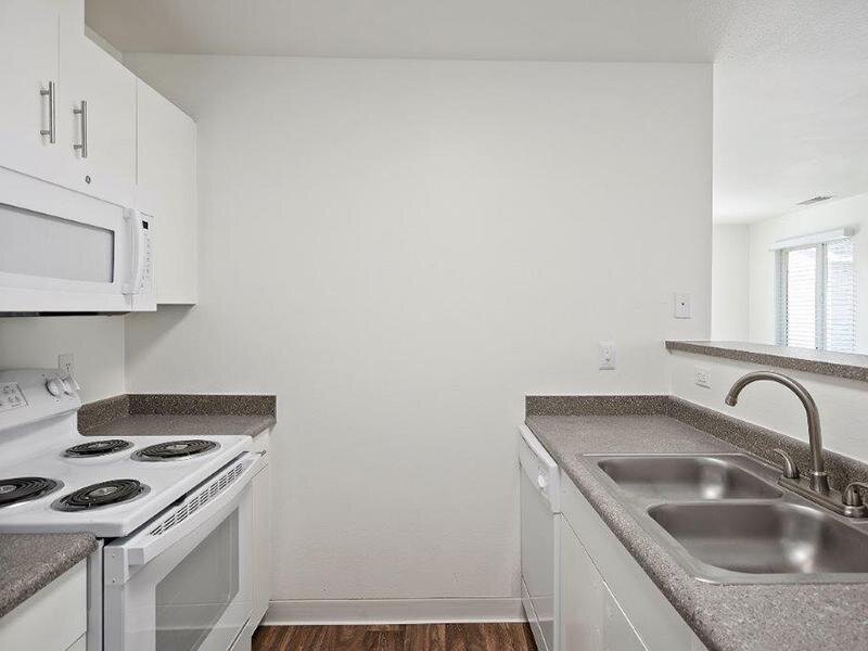 Kitchen with White Appliances | Cedar Square Apartments