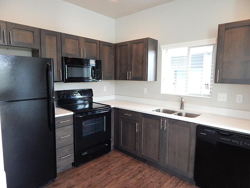 Kitchen with Black Appliances | Salt Lake City Apartments at Prana