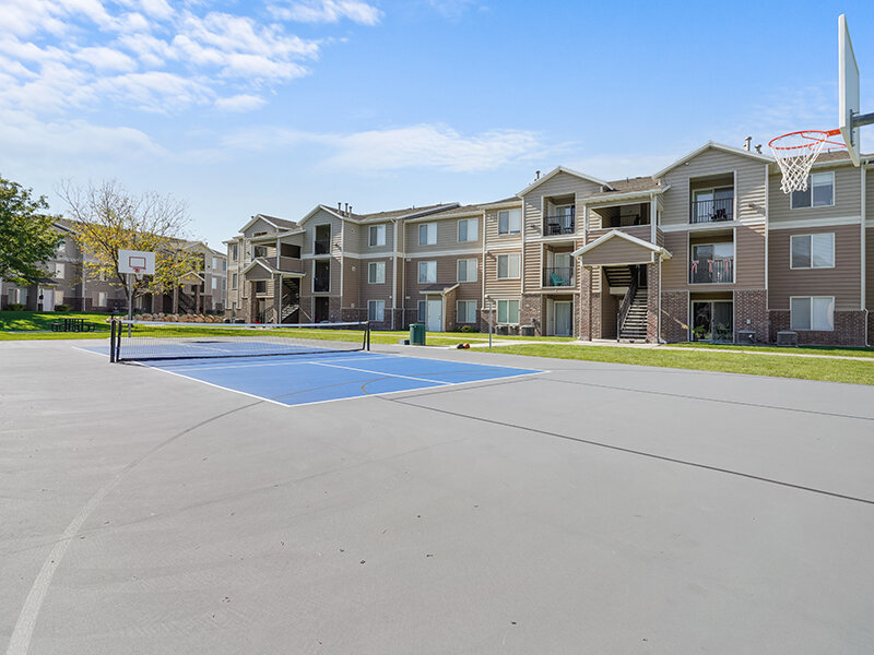 Sports Court & Exterior | Settlers Landing Apartments in West Haven, UT