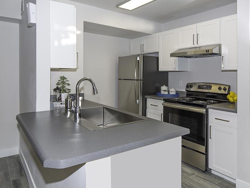 Apartments for Rent in Taylorsville - Gourmet Kitchen with Stainless Steel Appliances and Bar Top Counter
