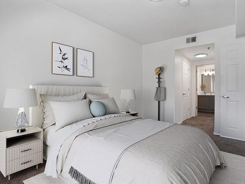 Bedroom with Nightstand and Entrance to Bathroom | Wasatch Commons