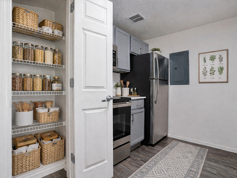 Kitchen Pantry with Refrigerator and Wooden Flooring | Wasatch Commons