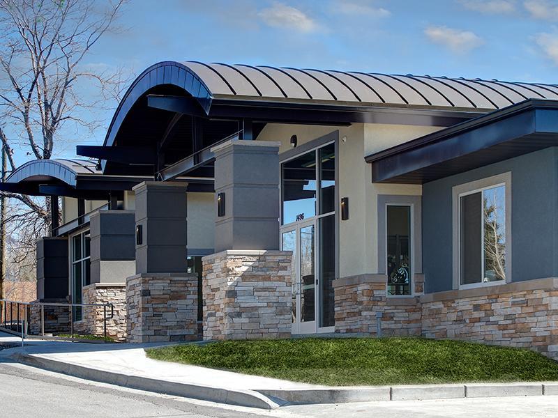 Pet Friendly Apartments in Holladay, UT - Sandpiper - Street View Of Building Exterior With Stone Details