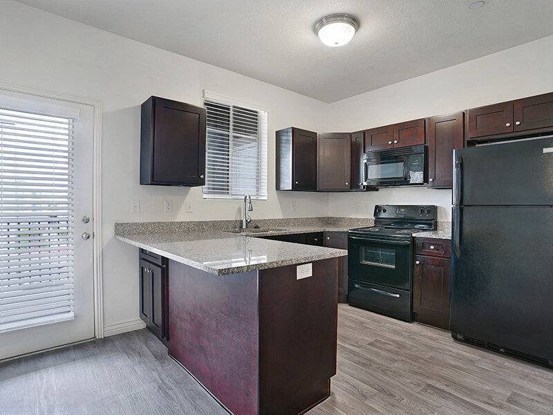 Kitchen with Counter and Wood Styled Cupboards | Eastgate at Greyhawk