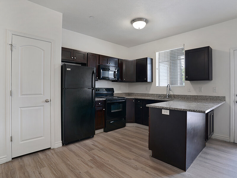 Kitchen with Wood Style Flooring and Ceiling Light | Eastgate at Greyhawk