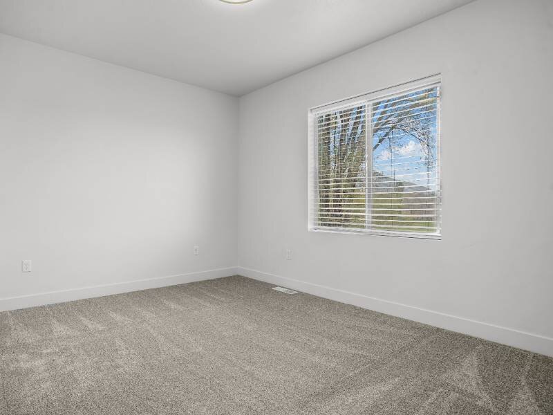 Carpeted Bedroom | Foxridge Townhomes in Ogden, UT