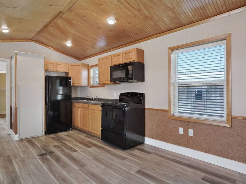 Kitchen with Black Appliances | Targhee Place