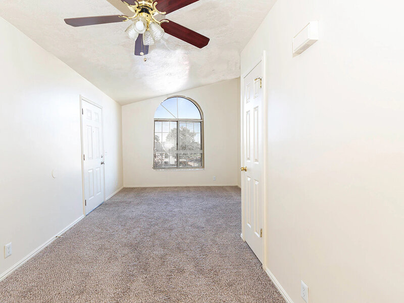 Living Room with Ceiling Fan and Carpeted Flooring | Woods Crossing