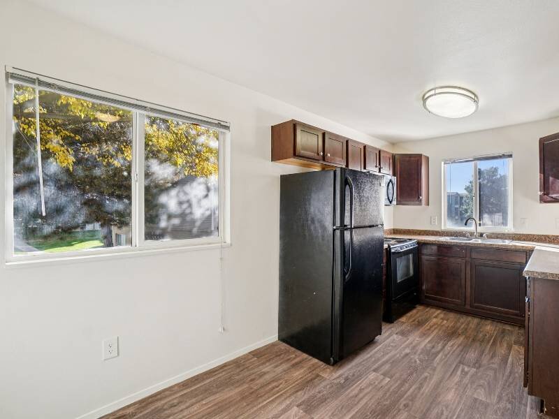 Wood Flooring Throughout Kitchen and Dining Area | Village Park Apartments