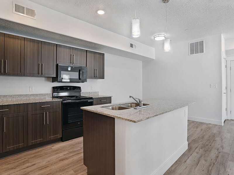 Kitchen with Wood Style Flooring and Sink | Mill Point