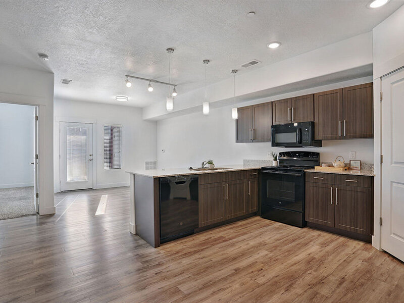 Kitchen Appliances with Wood Style Flooring and Wood Style Cabinets | Mill Point