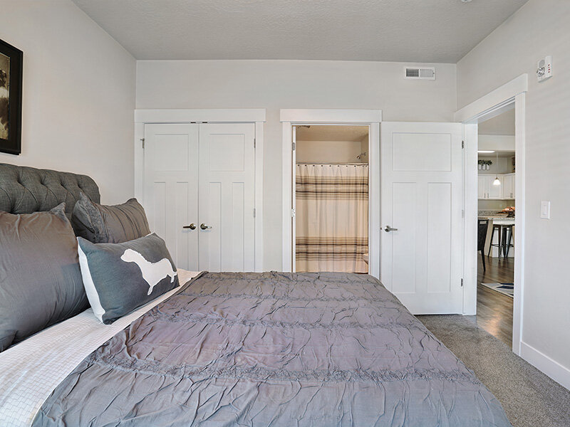 Bedroom with Closet and Carpeted Flooring | Draper Village