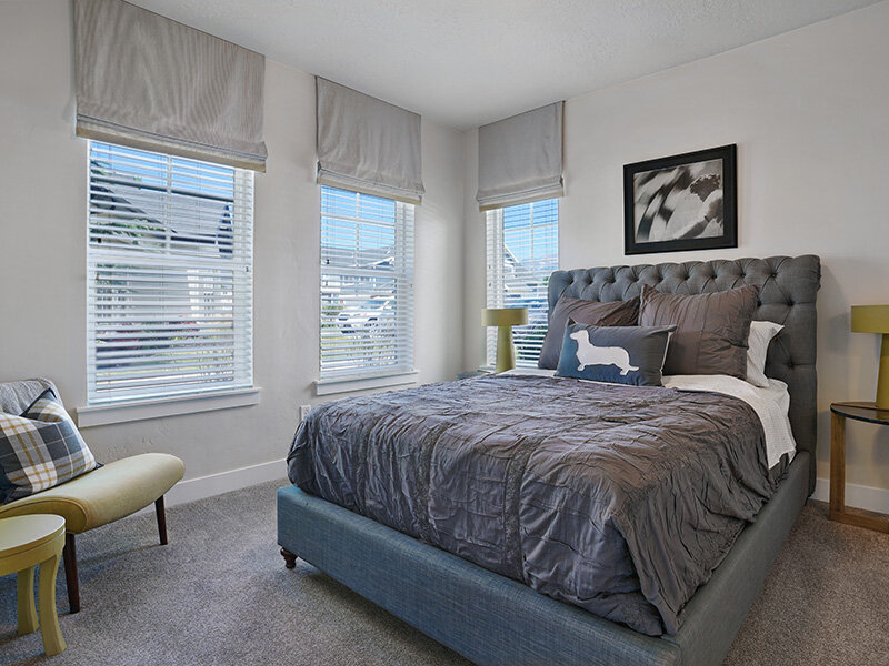 Apartment Bedroom with Windows and Wall Art | Draper Village