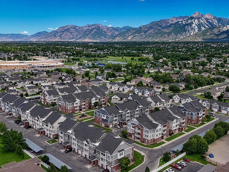 Aerial City Views of Apartment Property with Mountains | Draper Village