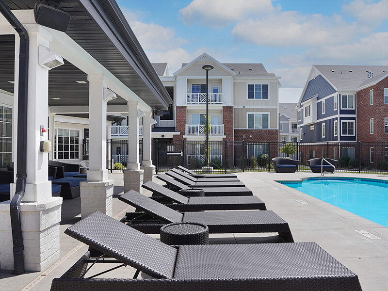 Exterior Lounge Seats by Outdoor Pool | Draper Village